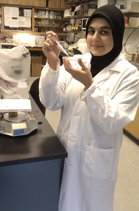 Master of Science student Hina Akhter working in a biology lab